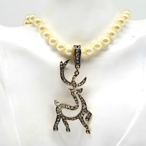 Heidi Daus Diamond Swarovski Crystal Reindeer Enhancer on Ivory Pearl Necklace